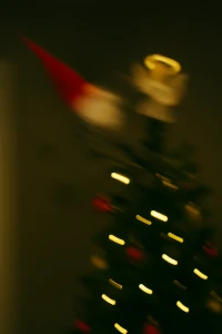 Blurry photo of Sockwinkel flying through the air hitting the christmas tree
